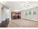 This open-concept home features a living room connected to the kitchen with hardwood floors at 726 Independence Ln, Acworth, GA 30102