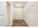 Spacious walk-in closet with carpet floors and multiple shelving racks for optimal storage space at 726 Independence Ln, Acworth, GA 30102