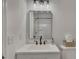 Updated bathroom featuring modern lighting, square mirror, and white sink at 2265 Colony Dr, Canton, GA 30114
