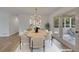 Cozy dining room featuring luxury vinyl floors, modern lighting, and access to outdoor patio at 2265 Colony Dr, Canton, GA 30114