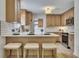 Updated kitchen featuring stainless steel appliances, breakfast bar, and stone countertops at 2265 Colony Dr, Canton, GA 30114