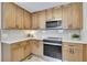 Bright kitchen featuring stainless steel appliances, stone countertops, and tile backsplash at 2265 Colony Dr, Canton, GA 30114
