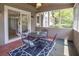 Enclosed sunroom featuring a ceiling fan, furniture set, and large windows for ample natural light at 2265 Colony Dr, Canton, GA 30114