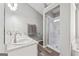 A bathroom featuring a double sink vanity, walk-in shower, and soaking tub at 2350 Laurel Pointe Ln, Lawrenceville, GA 30043