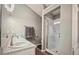 Bright bathroom features double sinks, a glass shower, and a walk-in shower at 2350 Laurel Pointe Ln, Lawrenceville, GA 30043