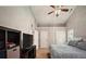 Spacious bedroom with a ceiling fan, carpet, and three doors at 2350 Laurel Pointe Ln, Lawrenceville, GA 30043