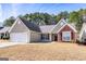 Charming single-Gathering home with a well-manicured front yard and attached two-car garage at 2350 Laurel Pointe Ln, Lawrenceville, GA 30043