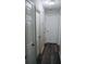 Hallway features multiple white doors and dark hardwood floors at 2350 Laurel Pointe Ln, Lawrenceville, GA 30043