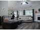 Bright living room features a fireplace, wood floors, and comfortable seating at 2350 Laurel Pointe Ln, Lawrenceville, GA 30043