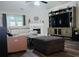 Bright living room features a fireplace, wood floors, and comfortable seating at 2350 Laurel Pointe Ln, Lawrenceville, GA 30043