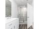 Modern bathroom featuring a glass-enclosed shower with stylish tile work, and a double sink vanity at 3021 Cambridge Mill St, Acworth, GA 30102