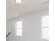 Well-lit bedroom features two large windows, neutral walls, and plush carpet, a cozy space at 3021 Cambridge Mill St, Acworth, GA 30102