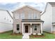 Charming two-story home featuring a classic brick facade and a welcoming front porch at 3021 Cambridge Mill St, Acworth, GA 30102
