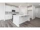 Modern kitchen featuring white cabinets, a center island, and stainless steel appliances at 3021 Cambridge Mill St, Acworth, GA 30102