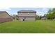 Expansive backyard with lush green grass, offering ample space for outdoor activities and relaxation at 577 Joneus Dr, Mcdonough, GA 30252