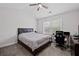 Bedroom featuring a window, ceiling fan, and a workspace with a desk and chair at 577 Joneus Dr, Mcdonough, GA 30252