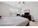 Bedroom features a dark wood dresser with a TV, and a window offering natural light at 577 Joneus Dr, Mcdonough, GA 30252