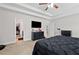 Bedroom features a dark gray bed and a flat screen television on the wall at 577 Joneus Dr, Mcdonough, GA 30252