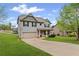 Charming two-story home with a well-maintained lawn and a two-car garage at 577 Joneus Dr, Mcdonough, GA 30252