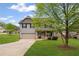 Two-story home with a well-maintained lawn and a two-car garage at 577 Joneus Dr, Mcdonough, GA 30252