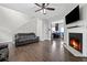 Cozy living room features a fireplace, hardwood floors and comfortable seating at 577 Joneus Dr, Mcdonough, GA 30252