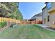 Spacious backyard with a well-maintained lawn and wooden fence at 1205 Apple Blossom Dr, Cumming, GA 30041