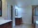 Bathroom boasts tile floor, double vanity, framed mirror, walk-in shower, and soaking tub at 1205 Apple Blossom Dr, Cumming, GA 30041