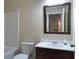 Bathroom featuring a vanity with a framed mirror, a toilet, and a shower-tub combination at 1205 Apple Blossom Dr, Cumming, GA 30041