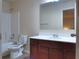 Bathroom with tile floor, single vanity, framed mirror, and shower-tub combination at 1205 Apple Blossom Dr, Cumming, GA 30041