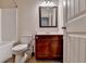 Neutral bathroom features a shower and bath tub with vanity and dark cabinets at 1205 Apple Blossom Dr, Cumming, GA 30041