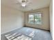 Bedroom with plush carpet and a window providing natural light at 1205 Apple Blossom Dr, Cumming, GA 30041