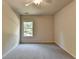 Bedroom with a window and carpeted flooring at 1205 Apple Blossom Dr, Cumming, GA 30041