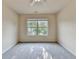 Bright bedroom with neutral walls and a large window at 1205 Apple Blossom Dr, Cumming, GA 30041