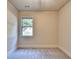 Neutral bedroom featuring large window allowing for natural light at 1205 Apple Blossom Dr, Cumming, GA 30041