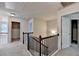 Hallway features rod iron railing and access to several rooms at 1205 Apple Blossom Dr, Cumming, GA 30041