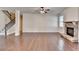 Spacious living room with stone fireplace, hardwood floors, and staircase at 1205 Apple Blossom Dr, Cumming, GA 30041