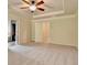 Spacious main bedroom with a ceiling fan, plush carpet, and a doorway at 1205 Apple Blossom Dr, Cumming, GA 30041