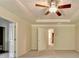 Spacious main bedroom with a ceiling fan, plush carpet, and a doorway to the hallway at 1205 Apple Blossom Dr, Cumming, GA 30041
