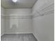 Walk-in closet with built-in shelves and carpeted flooring at 1205 Apple Blossom Dr, Cumming, GA 30041