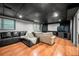 Large basement has a projector screen, living room area and provides space for entertaining at 2240 Murdock Rd, Marietta, GA 30062