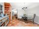 Bright breakfast nook with large corner hutch, terra cotta tile floor and glass-top dining table at 2240 Murdock Rd, Marietta, GA 30062