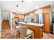 Eat-in kitchen featuring granite counters, stainless appliances, central island and terracotta tile floor at 2240 Murdock Rd, Marietta, GA 30062
