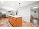 Open concept kitchen with eat-in island and terra cotta tile flooring at 2240 Murdock Rd, Marietta, GA 30062