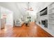 Open concept living room with brick fireplace, hardwood floors and lots of natural light at 2240 Murdock Rd, Marietta, GA 30062
