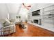 Bright living room boasts vaulted ceilings, hardwood floors, built-in shelving and fireplace at 2240 Murdock Rd, Marietta, GA 30062