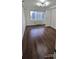 Bedroom features hardwood floors, window, and white door at 2479 Peachtree Ne Rd # 902, Atlanta, GA 30305