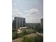 Stunning city views from a high-rise apartment with lush greenery and beautiful clouds at 2479 Peachtree Ne Rd # 902, Atlanta, GA 30305