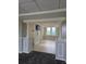 Hallway with elevators and a sitting area with a view of the skyline and some pillars at 2479 Peachtree Ne Rd # 902, Atlanta, GA 30305