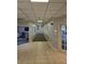 Well-lit hallway with tiled floors leading to a lounge area at 2479 Peachtree Ne Rd # 902, Atlanta, GA 30305