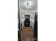 Galley kitchen featuring gray cabinets, stainless steel appliances, and hardwood floors at 2479 Peachtree Ne Rd # 902, Atlanta, GA 30305